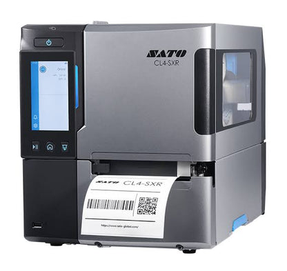 A silver and black SATO CL4-SXR industrial label printer with a built-in touchscreen display, a printed label tray, and a white label sheet emerging from the front, shown on a plain white background.