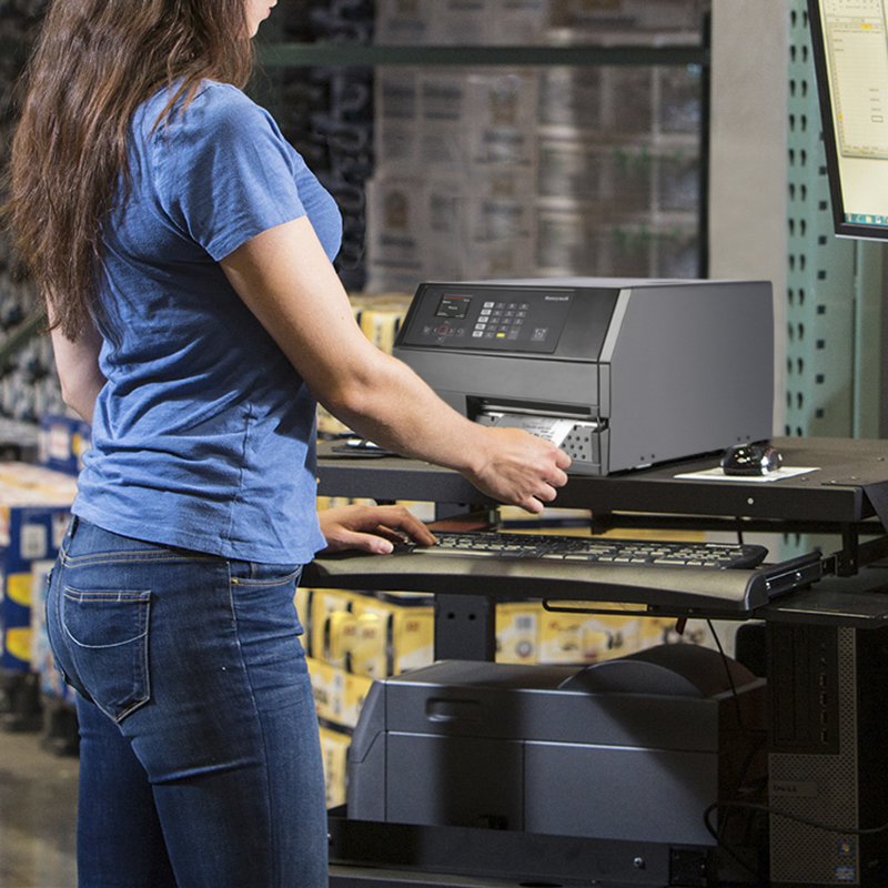 Person using a computer in a warehouse setting