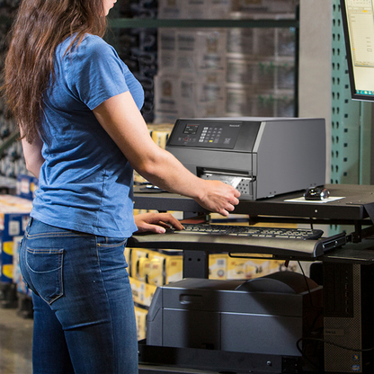 Person using a computer in a warehouse setting